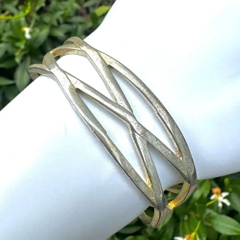 Silver tone cut outโopen cuff bracelet